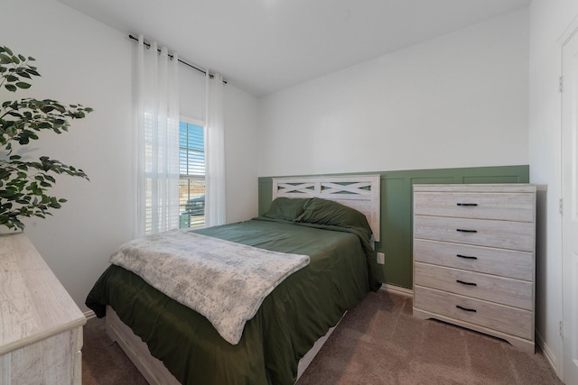 carpeted bedroom with vaulted ceiling