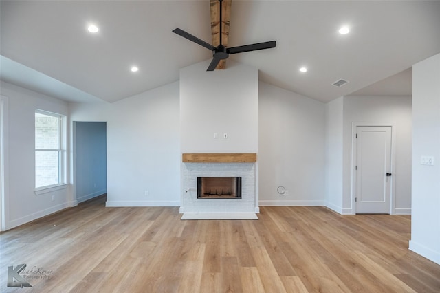 unfurnished living room featuring vaulted ceiling, ceiling fan, and light hardwood / wood-style flooring