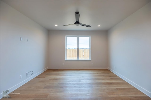 empty room with light hardwood / wood-style flooring and ceiling fan