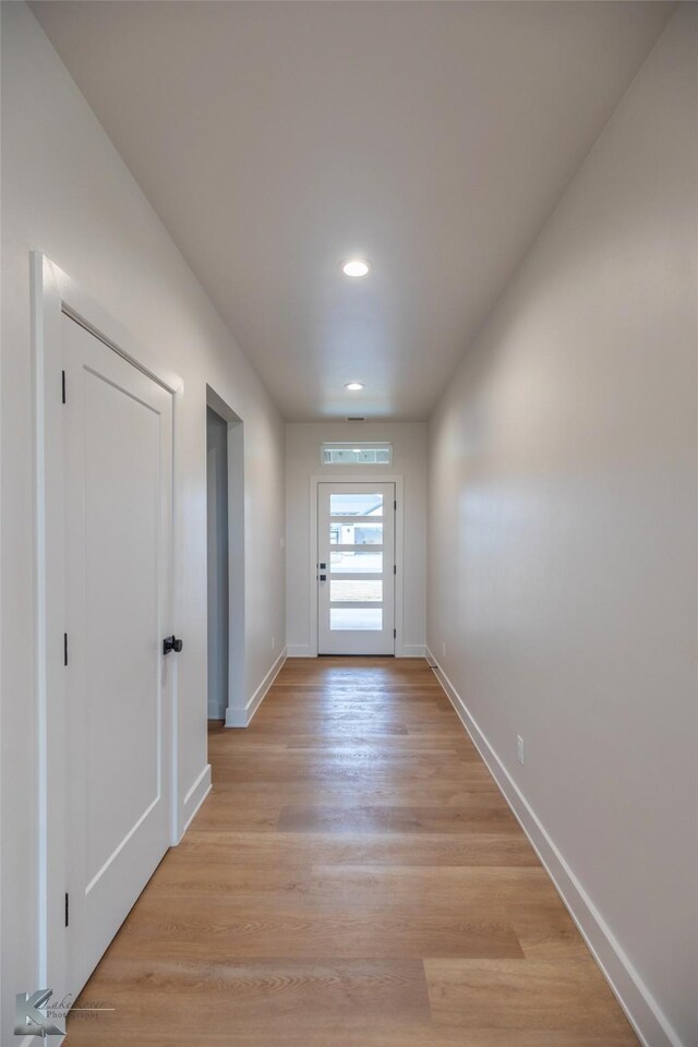 doorway with light hardwood / wood-style floors