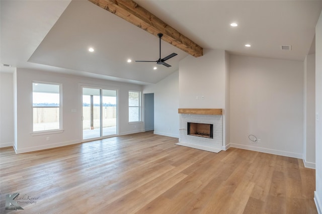 unfurnished living room with light hardwood / wood-style flooring, lofted ceiling with beams, and ceiling fan