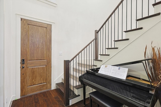 entrance foyer with dark hardwood / wood-style floors