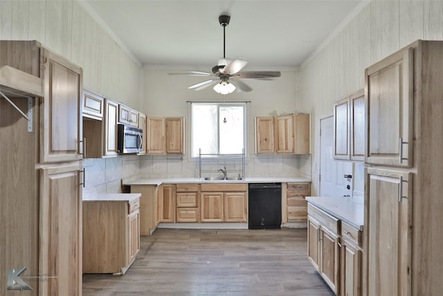 kitchen with light brown cabinets, sink, decorative backsplash, light wood-type flooring, and black dishwasher