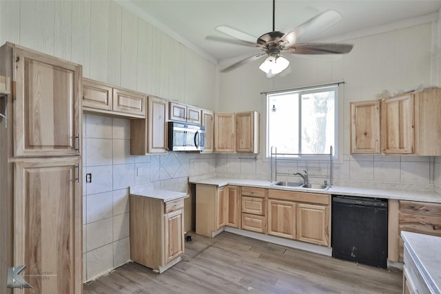 kitchen featuring dishwasher, light wood-type flooring, tasteful backsplash, and sink