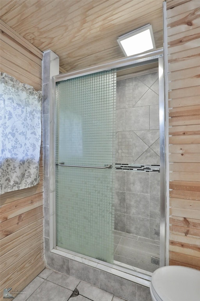 bathroom featuring tile patterned floors, wood walls, and wooden ceiling