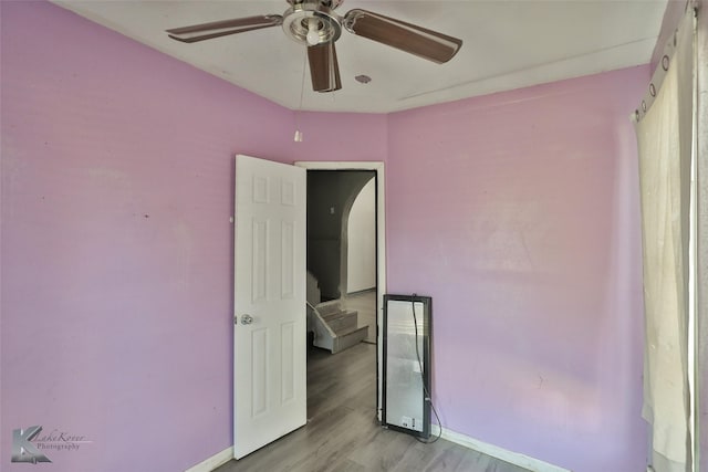 unfurnished bedroom featuring light hardwood / wood-style floors and ceiling fan