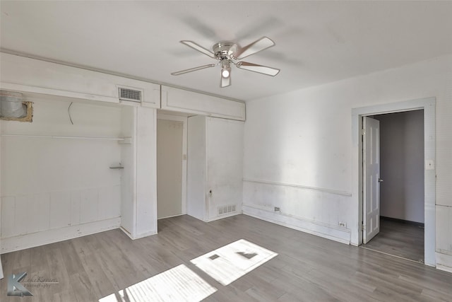 unfurnished bedroom with ceiling fan and light hardwood / wood-style flooring