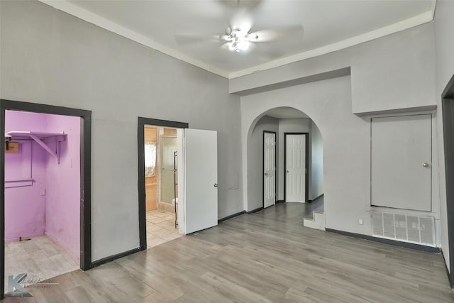 empty room featuring ceiling fan and light hardwood / wood-style floors