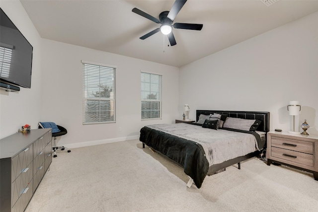 bedroom with light carpet and ceiling fan