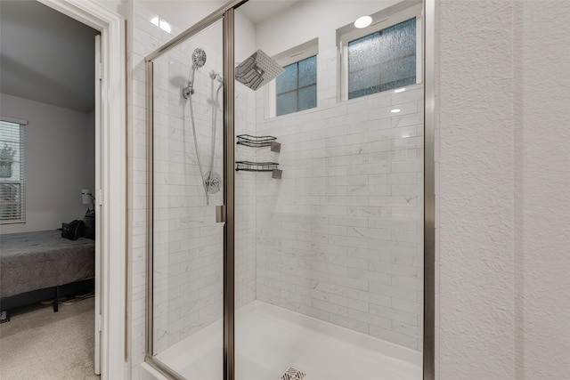 bathroom with a shower with shower door