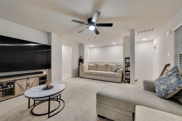 living room featuring ceiling fan and carpet floors