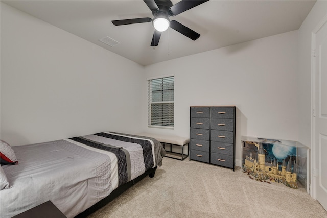 bedroom with light colored carpet and ceiling fan