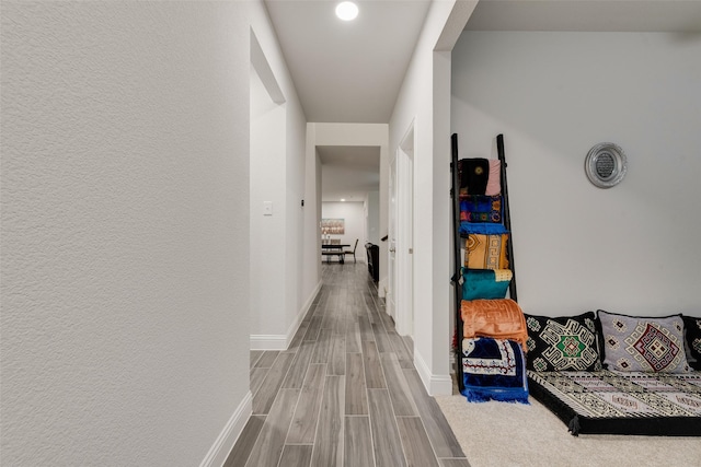 corridor featuring light hardwood / wood-style flooring