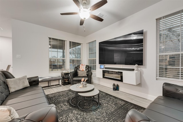 living room featuring ceiling fan