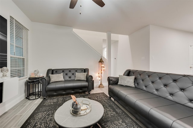 living room featuring ceiling fan and light hardwood / wood-style flooring