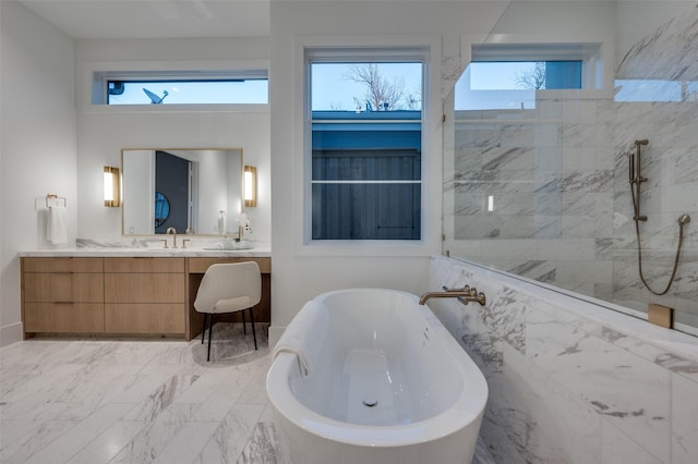 bathroom featuring separate shower and tub and vanity