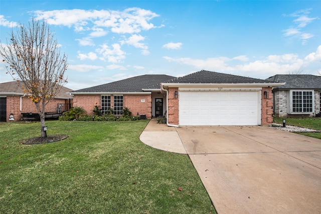 single story home featuring a garage and a front yard