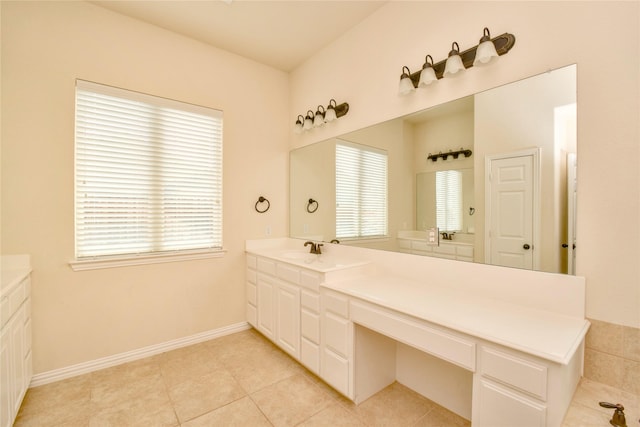 bathroom with tile patterned floors and vanity