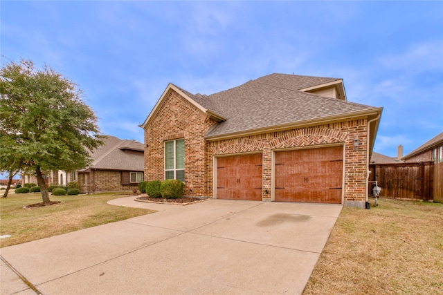 view of front property with a garage and a front yard