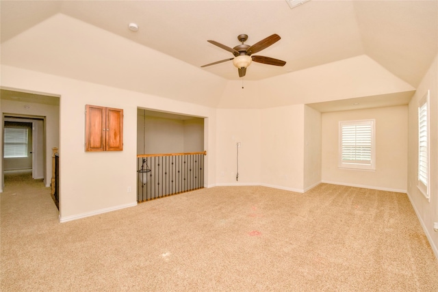 unfurnished room with light carpet, ceiling fan, and lofted ceiling