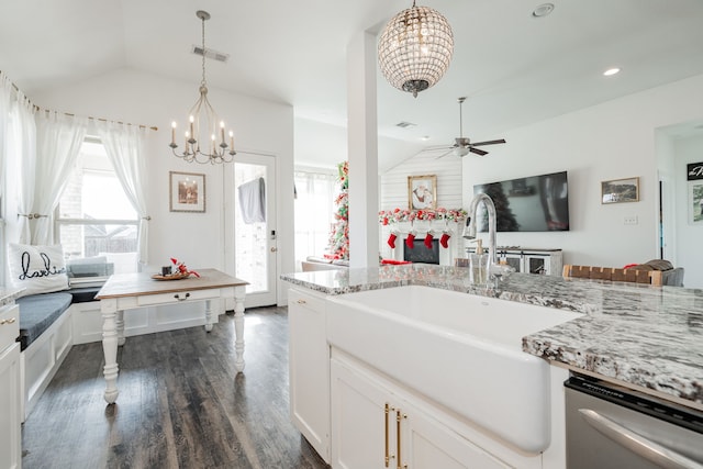 kitchen featuring white cabinets, sink, vaulted ceiling, dark hardwood / wood-style floors, and light stone counters