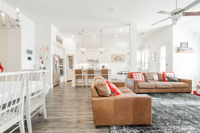 living room with ceiling fan and wood-type flooring