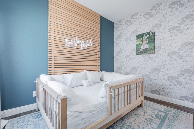 bedroom featuring wood-type flooring