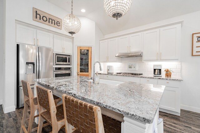 kitchen featuring hanging light fixtures, sink, dark hardwood / wood-style floors, appliances with stainless steel finishes, and white cabinetry