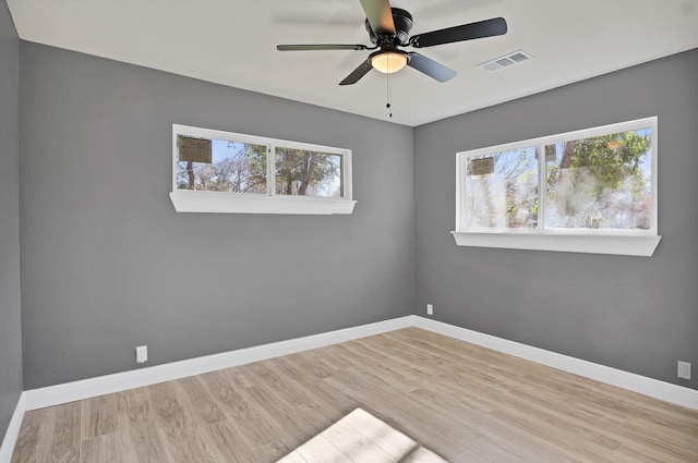 unfurnished room with ceiling fan and light hardwood / wood-style floors