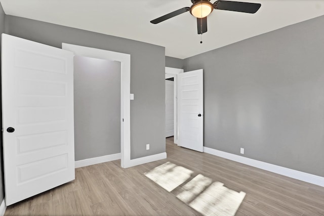 unfurnished bedroom featuring light hardwood / wood-style floors and ceiling fan