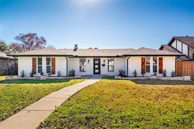 ranch-style home with a front yard