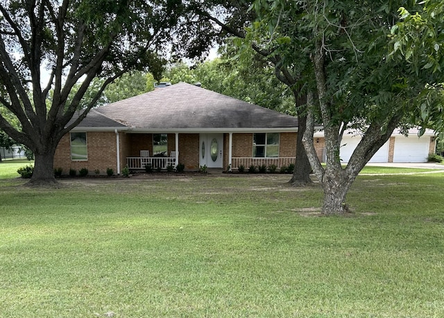 single story home featuring a porch and a front yard