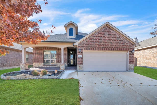 view of front property with covered porch and a garage