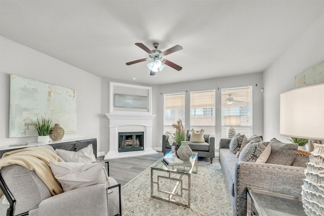 living room with hardwood / wood-style flooring and ceiling fan