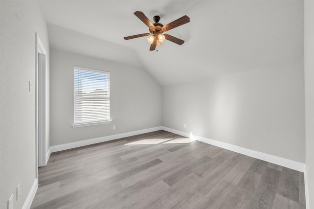 bonus room featuring light hardwood / wood-style floors, ceiling fan, and lofted ceiling