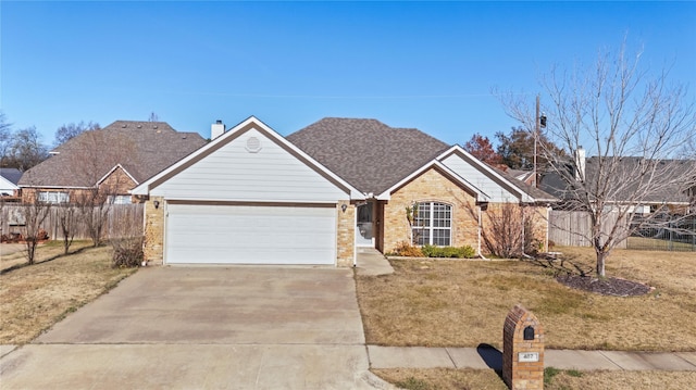 single story home featuring a garage and a front lawn