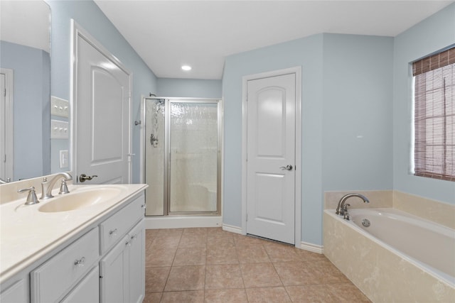 bathroom with plus walk in shower, vanity, and tile patterned floors