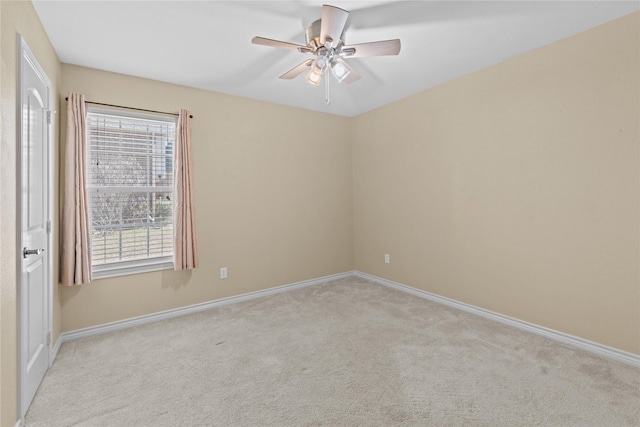 empty room with light carpet and ceiling fan