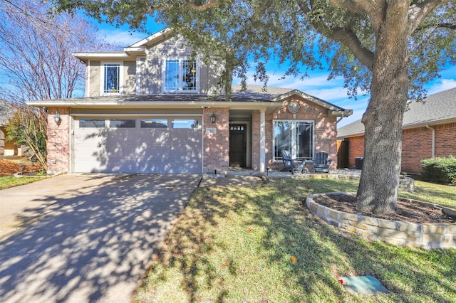 view of front of property featuring a garage and a front yard