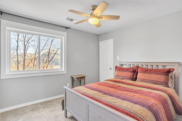 bedroom featuring light carpet and ceiling fan