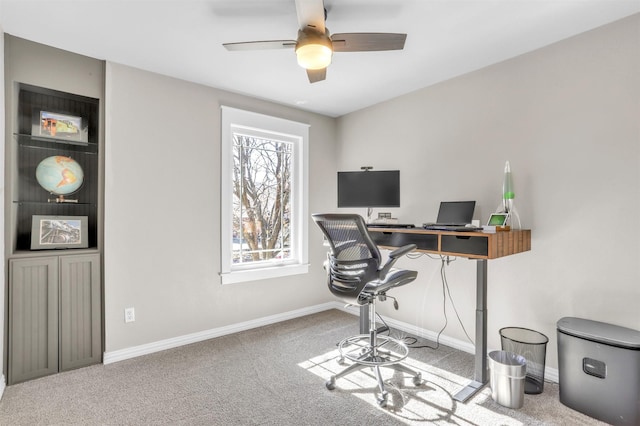 office space with carpet and ceiling fan