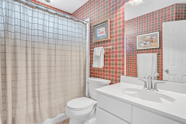 full bathroom with vanity, toilet, and shower / bath combo with shower curtain