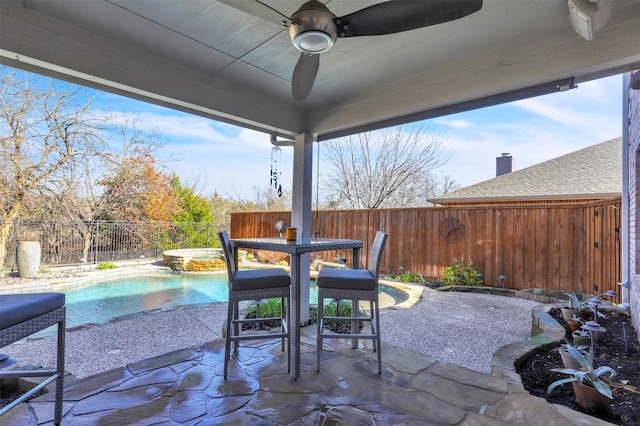 view of patio / terrace with a pool with hot tub and ceiling fan