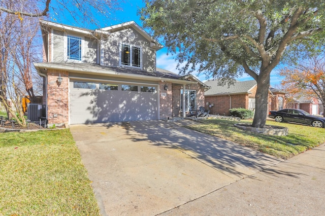 view of front of home with a garage, central AC, and a front yard