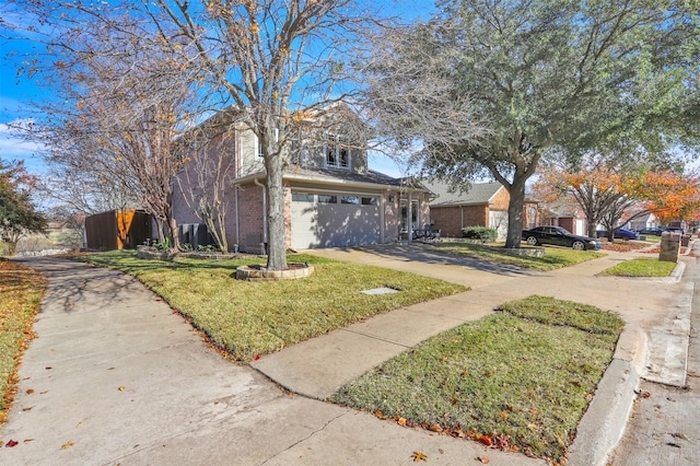 view of front property with a garage and a front lawn