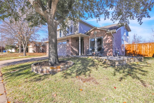 view of front facade with a garage and a front yard