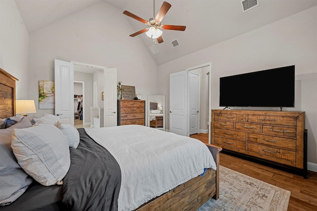 bedroom featuring ceiling fan, light wood-type flooring, and high vaulted ceiling