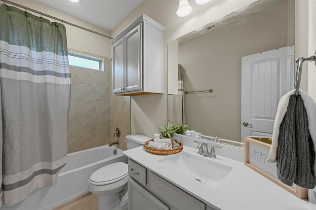 full bathroom with toilet, vanity, and shower / tub combo with curtain