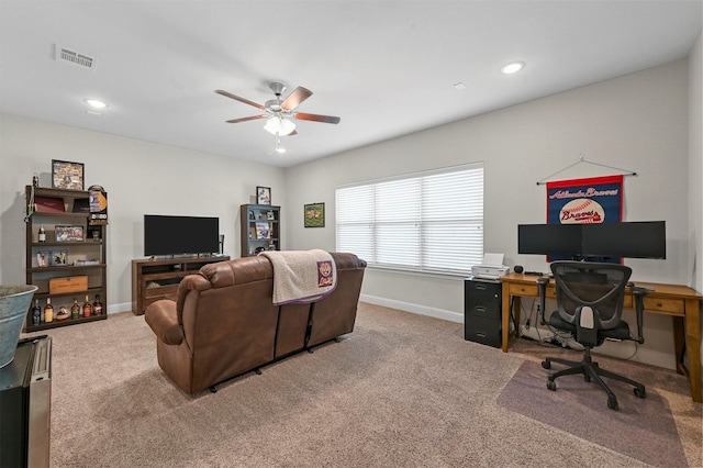 carpeted living room featuring ceiling fan