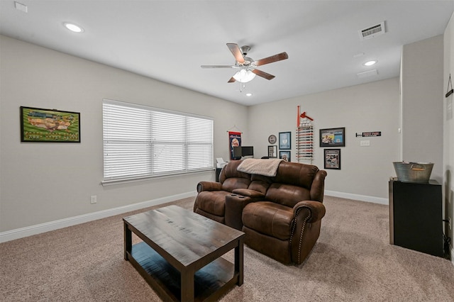 living room featuring light carpet and ceiling fan